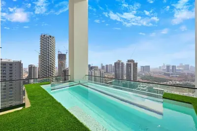 a swimming pool on the roof of a building at Golden Stays - Private Pool Modern 2BR Oasis in JVC in Dubai