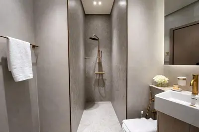 a bathroom with a shower and a toilet and a sink at Stylish Stay with Plunge Pool & Scenic Pool View in Dubai