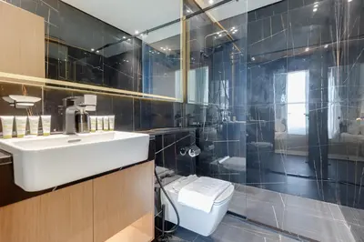 a bathroom with a sink and a toilet at Binghatti House, JVC - 1 Bedroom Apartment - Allsopp & Allsopp in Dubai
