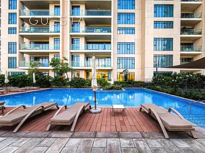 a swimming pool in front of a building at Vida The Hills Residences, Dubai in Dubai