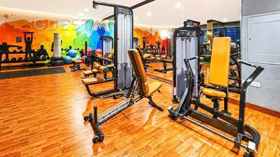 a gym with several tread machines in a room at Vida The Hills Residences, Dubai in Dubai