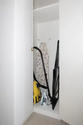 a closet with a door open with a bunch of equipment at Bright 2BR Marina View with Balcony in Dubai