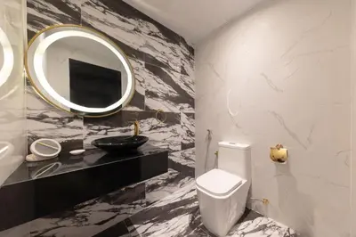 a bathroom with a sink and a toilet and a mirror at Bright 2BR Marina View with Balcony in Dubai