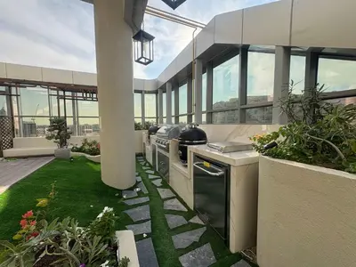 a kitchen in a house with a garden at Frank Porter - Adhara Star in Dubai