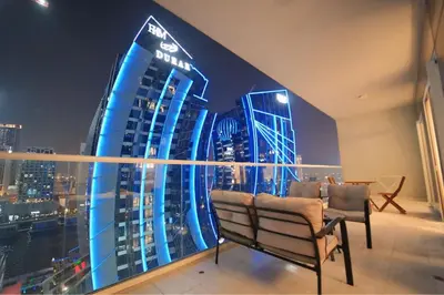 a room with a view of a city at night at Luxury 2BR in Business Bay Close to Dubai Mall in Dubai
