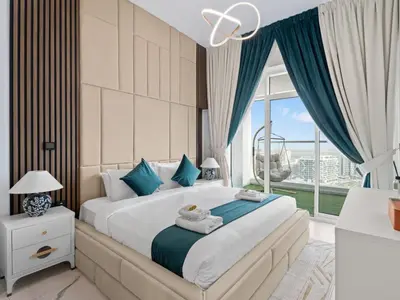 a bedroom with a large bed and a large window at Opalz Serenity Designer- 1BDR Retreat-07 in Dubai