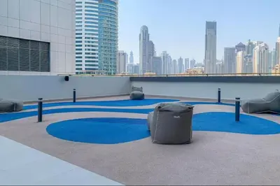 a suitcase sitting on the floor of a building at Vogue Downtown The Sterling by Omniyat, near Burj Khalifa and Dubai Mall, Studio Apartment with Balcony and Access to all Amenities in Dubai