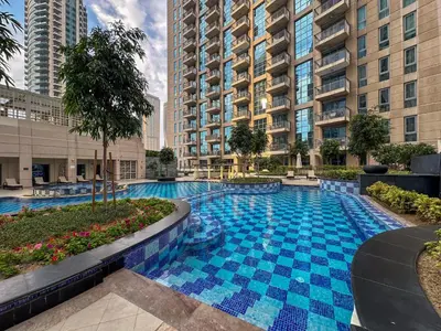 a swimming pool in the middle of a building at Burj Khalifa View 5 Min walk to Dubai Mall in Dubai