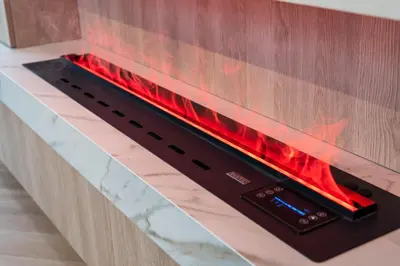 a fireplace with a red fire inside of it at Burj Khalifa View 5 Min walk to Dubai Mall in Dubai