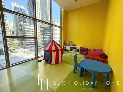 a living room with a table and a tent at LUX The Dubai Marina Skyline Suite 2 in Dubai