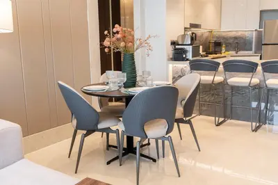 a dining room with a table and chairs at Luxury 2BR Nobles Tower Business Bay by Czechin in Dubai