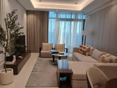 a living room with a couch and a table at Luxury 2BR Nobles Tower Business Bay by Czechin in Dubai