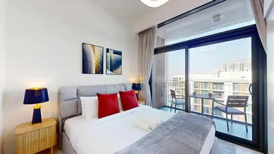 a bedroom with a bed and a large window at Vacationer l Vibrant 2 Bed l Dubai Hills Mall l Free Pool, Gym in Dubai