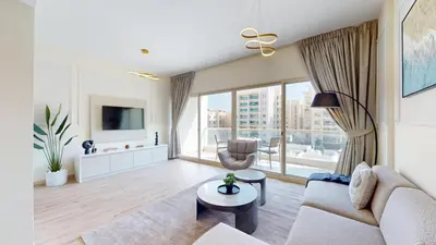 a living room with a couch and a table at Vacationer l Peaceful 2 Bed l Sheikh Zayed Road l The Greens in Dubai
