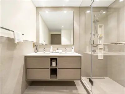 a bathroom with a sink and a mirror at Elite Burj Vista Downtown Dubai Apartments with Burj Khalifa View in Dubai