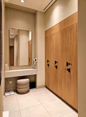 a bathroom with a toilet and a mirror at Spacious Luxury Apartments at Burj Vista with Direct Burj Khalifa Views in Dubai