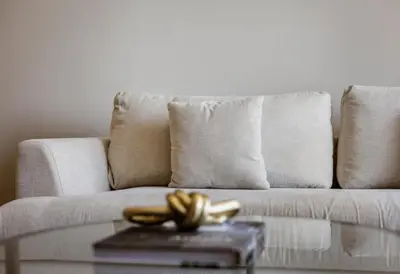 a bunch of bananas on a table in front of a couch at Exclusive Burj Khalifa View Downtown Burj Vista Apartments in Dubai