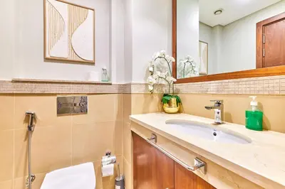 a bathroom with a sink and a mirror at Burj Khalifa View Apartments, Burj Vista Tower - Downtown in Dubai