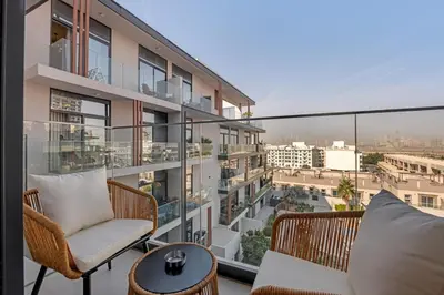 a balcony with a view of a city at Waves - Boho Style Chic Studio With Balcony in JVC in Dubai