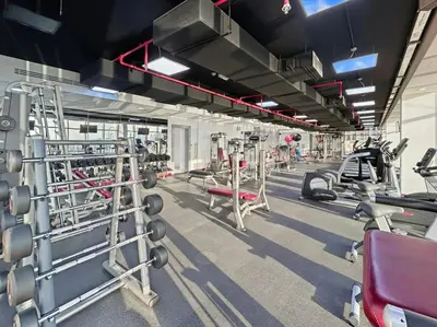 a gym with rows of equipment and machines at Amazing Studio with Balcony & Marina Eye Views in Dubai