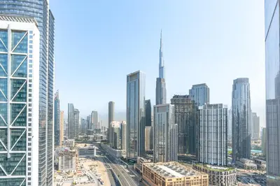 an aerial view of a city with tall buildings at RH - Luxury 2BR at Paramount Midtown, Burj Khalifa View in Dubai