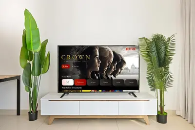 a tv in a living room with a white cabinet at Modern 1BDR Apt With Balcony Pool Access And JVC in Dubai