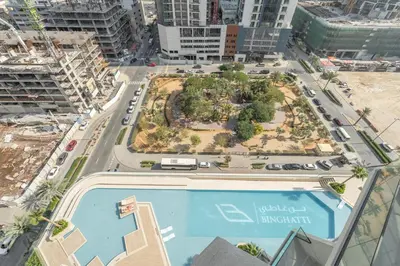 an aerial view of a city with a swimming pool at Luxury 1BR - Binghatti Phantom - Amazing Amenities in Dubai