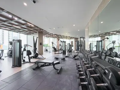 a gym with treadmills and cardio equipment in a building at Luxury 1BR - Binghatti Phantom - Amazing Amenities in Dubai