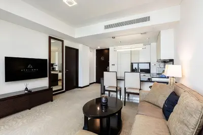 a living room with a couch and a table at JW Marriott Marina Apartments in Dubai