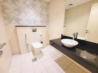 a bathroom with a toilet and a sink at DAMAC CAPITAL BAY - Blueocean Holiday Homes in Dubai