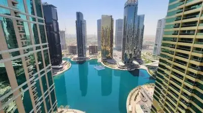 an aerial view of a city with tall buildings at Vogue JLT Global Lake View Tower near Marina and JBR, Two Bedroom Apartment with Balcony and City view, Access to all Amenities in Dubai
