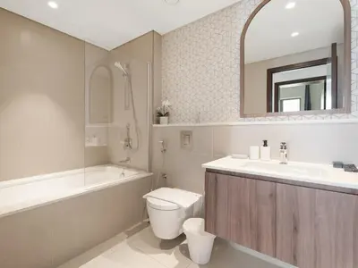 a bathroom with a sink and a toilet and a bath tub at Opulent Haven 2BDR w Sofa Bed Sleeps 6 In Vida-02 in Dubai