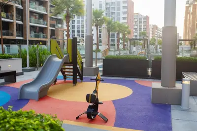 a playground in a city with chairs and a camera at Large Beautiful One Bed Downtown Dubai in Dubai
