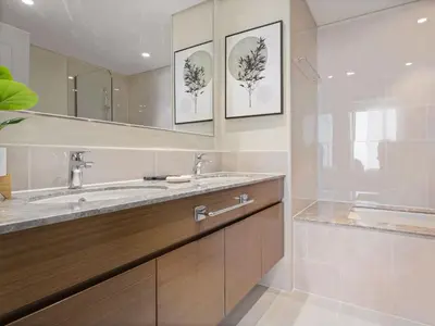 a bathroom with a sink and a mirror at Elegant Suites 2BDR In Forte Downtown-32 in Dubai