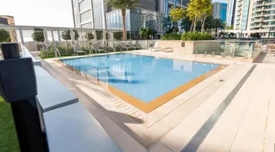 a swimming pool on top of a building at Elegant Suites 2BDR In Forte Downtown-32 in Dubai