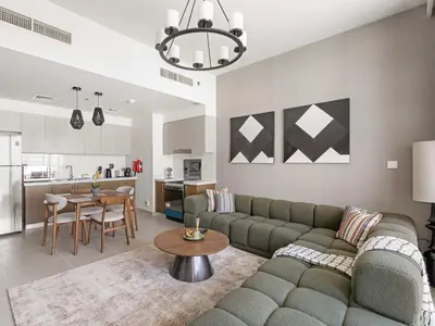 a living room with a couch and a table at Elegant Suites 2BDR In Forte Downtown-32 in Dubai