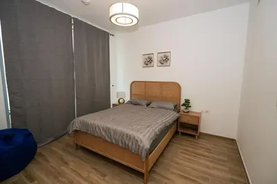 a bedroom with a bed in a room with a window at Skyline & Islands View 3BR Luxe Top Floor Noura Tower Business Bay in Dubai