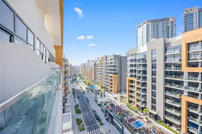 a view of a city street with tall buildings at Bloomfields Grandeur 2BR in Azizi Riviera in Dubai