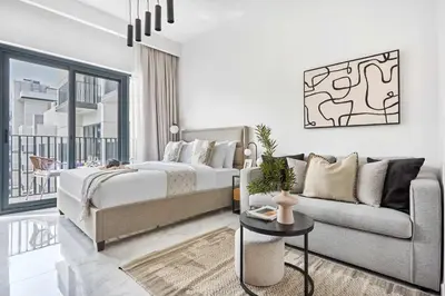 a bedroom with a bed and a couch at Frank Porter - Azizi Beach Oasis in Dubai
