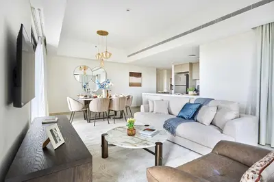 a living room with a couch and a table at Frank Porter - Al Jazi in Dubai