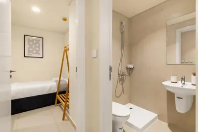 a bathroom with a sink and a toilet and a shower at 4BR - Stunning Burj View - Dubai Mall Access in Dubai