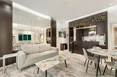 a living room with a couch and a table at FIRST CLASS 2BR Vibrant Next to Dubai Mall in Dubai