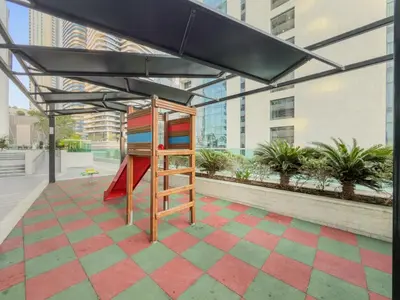 a room with a colorful floor with a ladder and an umbrella at FIRST CLASS 2BR Vibrant Next to Dubai Mall in Dubai