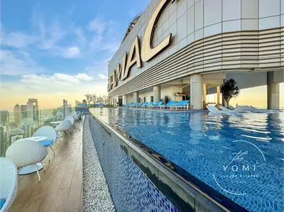 a swimming pool on the roof of a building at Paramount 10 Min to Dubai Mall, Luxury Amenities in Dubai
