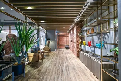 an office with a hallway with plants and shelves at Paramount 10 Min to Dubai Mall, Luxury Amenities in Dubai