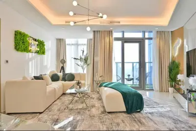 a living room with a couch and a table at Paramount 10 Min to Dubai Mall, Luxury Amenities in Dubai