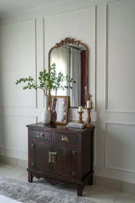 a mirror on top of a dresser in a room at Burj Khalifa 2 BR apartment in the down town in Dubai