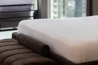 a close up of a bed with a brown blanket at Burj Khalifa View, Luxury 2B, Top Amenities and Equipment in Dubai