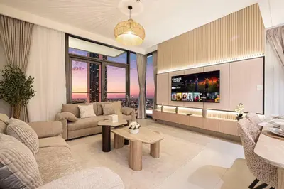 a living room with a couch and a tv at Mahogany 25 - 2BR 10 Guests - Walk to Dubai Mall in Dubai