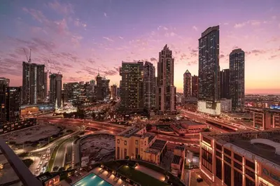 a view of a city at night with traffic at Mahogany 25 - 2BR 10 Guests - Walk to Dubai Mall in Dubai
